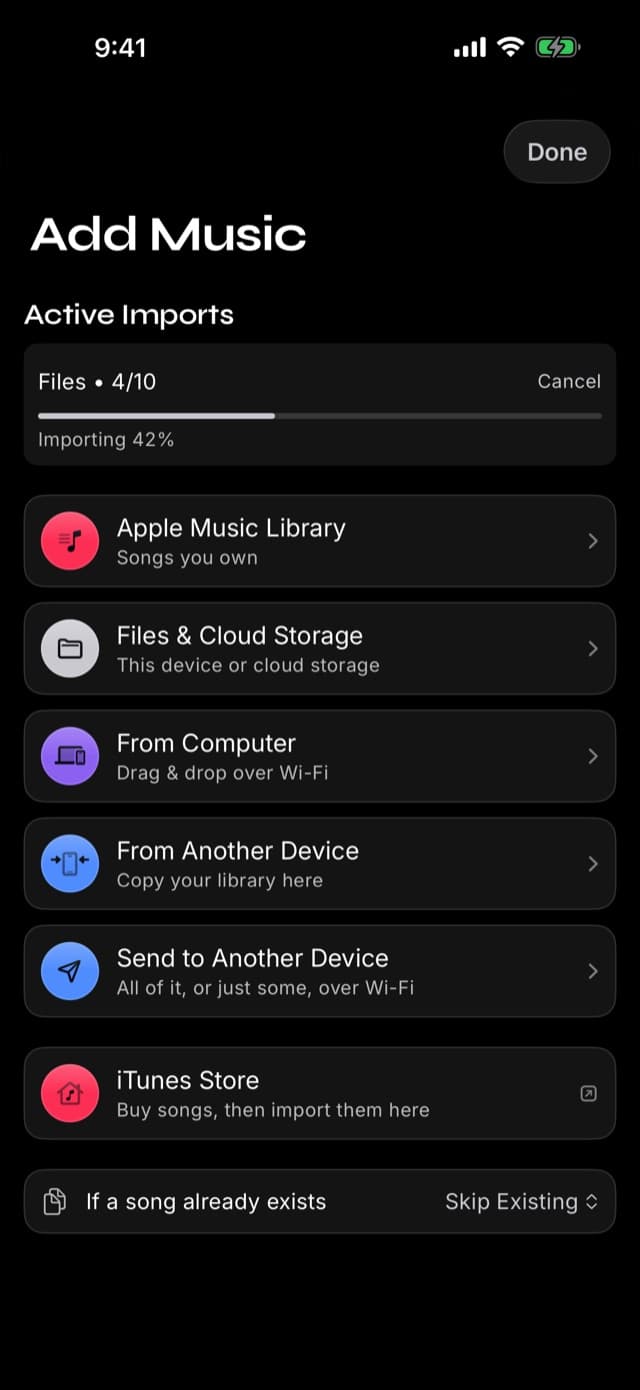 The Add Music screen in Prismatic Music with an import in progress, showing a progress bar and a count of songs imported