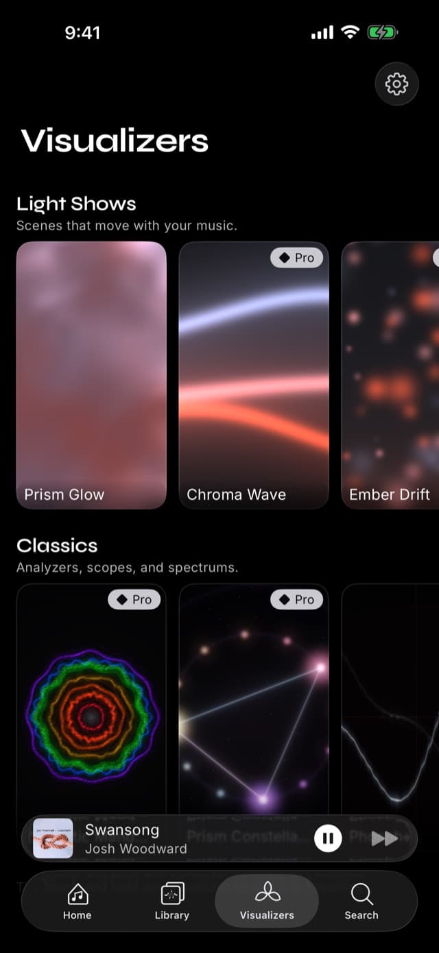 The Visualizers tab in Prismatic Music showing shelves of live scene previews